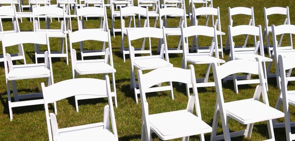 white chairs on the grass