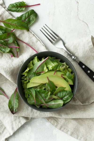 Green vegan breakfast meal in bowl. Clean eating, dieting, vegan food concept