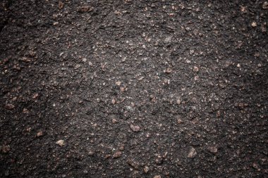 Güzel bir doku ile siyah asfalt yol. Taze ve sıcak asfalt. Sabah veya öğleden sonra asfalt