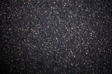 Güzel bir doku ile siyah asfalt yol. Taze ve sıcak asfalt. Sabah veya öğleden sonra asfalt