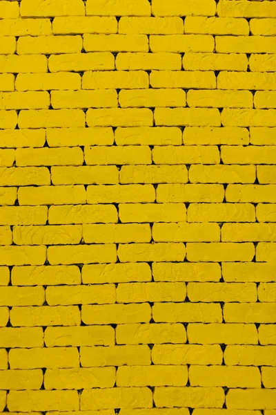 Yellow background. A yellow wall. The yellow brick. Large brick wall
