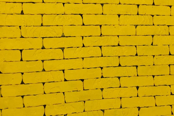 Yellow background. A yellow wall. The yellow brick. Large brick wall