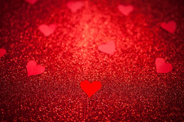 red shiny background with red little hearts, love, Valentine\'s Day, texture abstract background, suitable for ads,