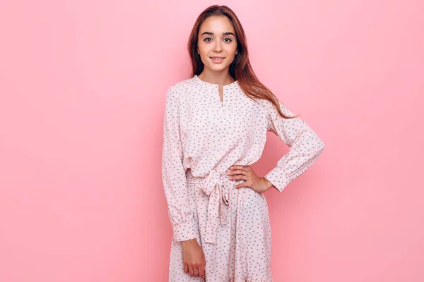 Young woman in a stylish dress. Girl posing on a pink background — 스톡 사진