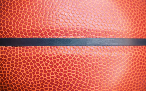 Closeup detail of basketball ball texture background