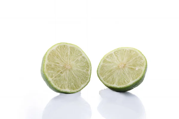 Green Lime with slice cutting isolated on white background — Stock Photo, Image