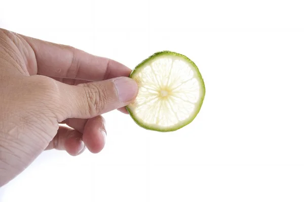Green Lime with hand isolated on white background — Stock Photo, Image