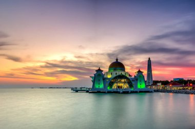 Beautiful sunset over the majestic mosque clipart