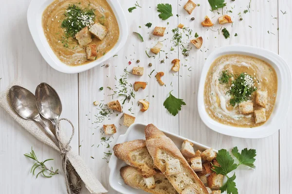 Cream soups with croutons and toasts — Stock Photo, Image