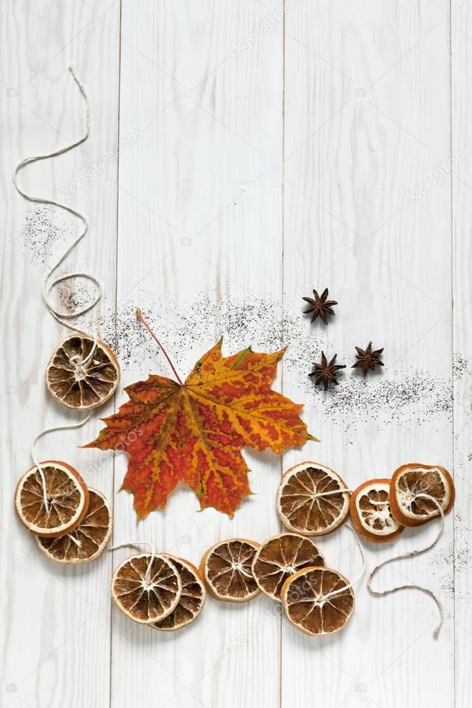 dried lemons on rope with maple leaf