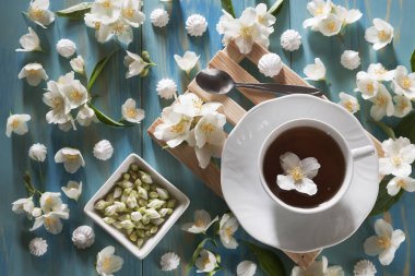 cup of tea with jasmine flowers 