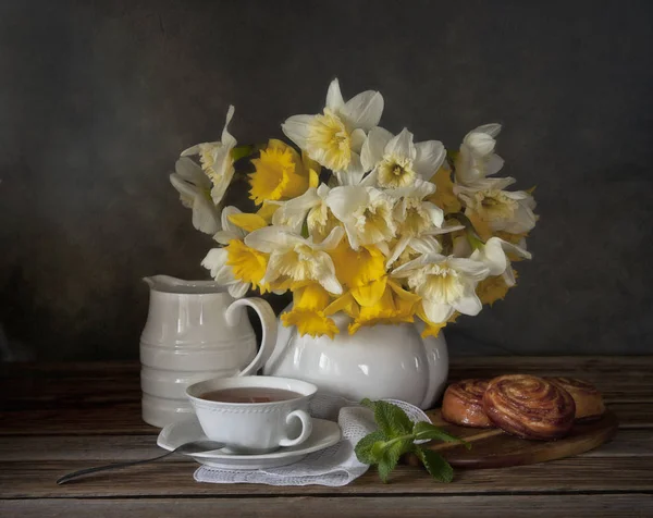 Yellow flowers with pot and cup — Stock Photo, Image