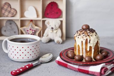 Cup of black coffee and a cupcake. Composition with different kinds of heart symbol. Concept for Valentine's day and romantic parties, events. Close-up, selective focus, shallow depth of field