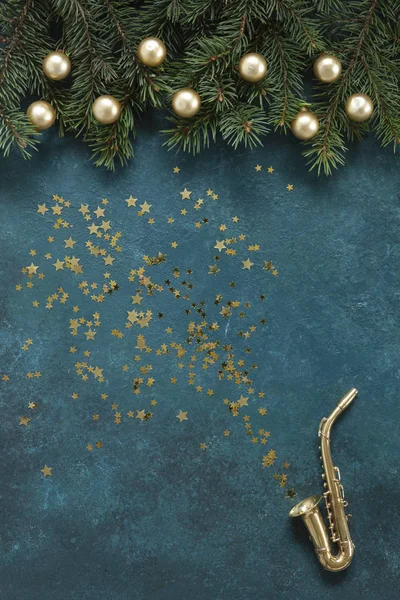 Miniature golden saxophone copy with Christmas decor and glitter — Stock Photo, Image
