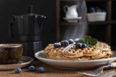 Close-up of soft Viennese waffles with blueberries 