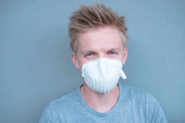 Man wearing FFP3 face protection mask against new coronavirus