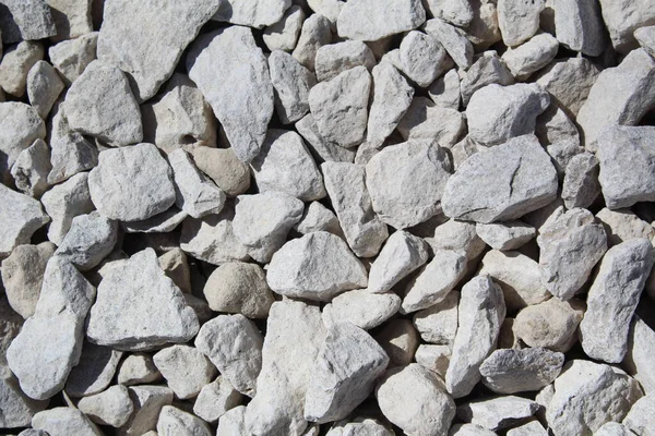 Fondo Una Pared Que Consiste Pequeñas Piedras Blancas Foto Piedras — Foto de Stock