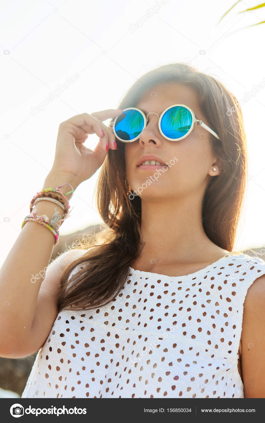 Girl in sunglasses during sunset. Stock Photo by ©nikkolia 156850034