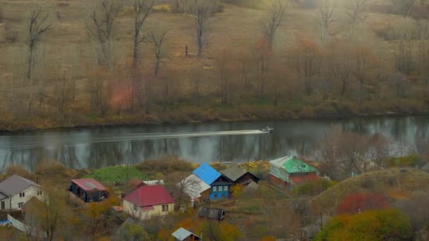 Motor Boat Moves River Village Autumn Day — Stock Video