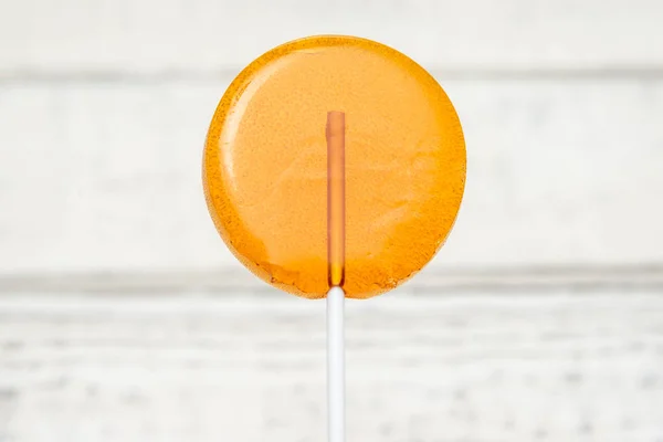Doces de laranja, doces doces em um pau — Fotografia de Stock