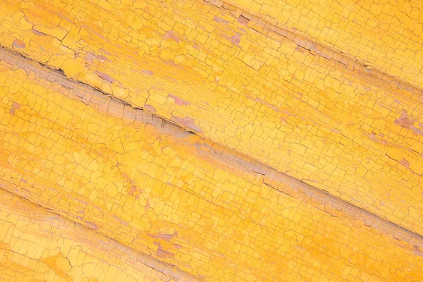 Textura, fondo, pintura amarilla vieja en las tablas — Foto de Stock