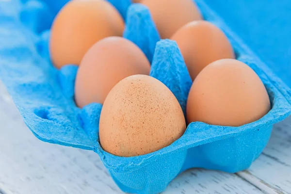 yellow eggs in a blue tray