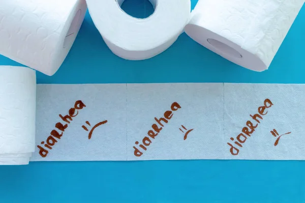 Rolls of white toilet paper labeled \