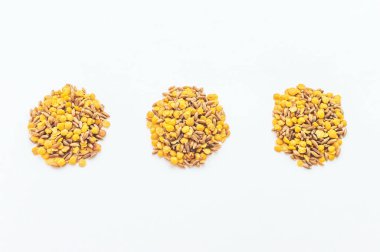 several piles of lentils and spelt on a white background. Healthy lifestyle, vegetarianism. Fight with excess weight.