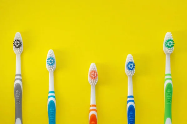 Multicolored Toothbrushes Yellow Background View Top Concept Dental Health — Stock Photo, Image