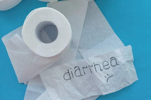 Rolls of white toilet paper labeled \