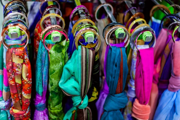 Womens scarves hanging in a store — Stock Photo, Image