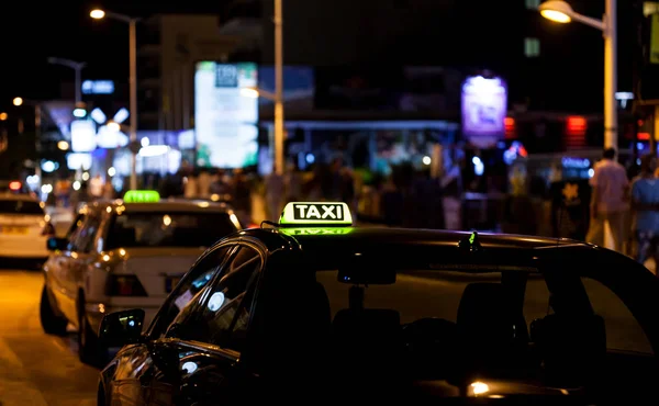 Taxi sign on the roof of a car — Stock Photo, Image
