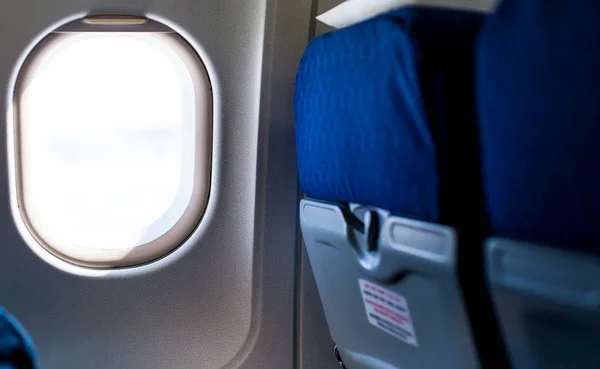 Empty seats and window in aircraft — Stock Photo, Image