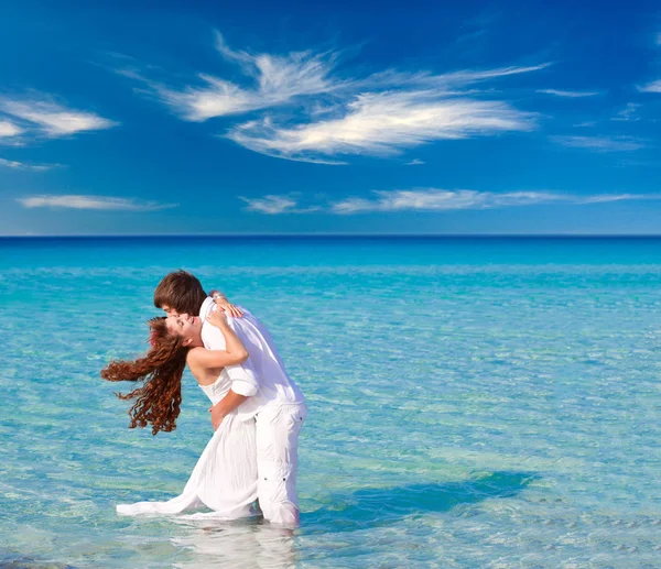 Very happy couple enjoy each other on the beach — Stock Photo, Image