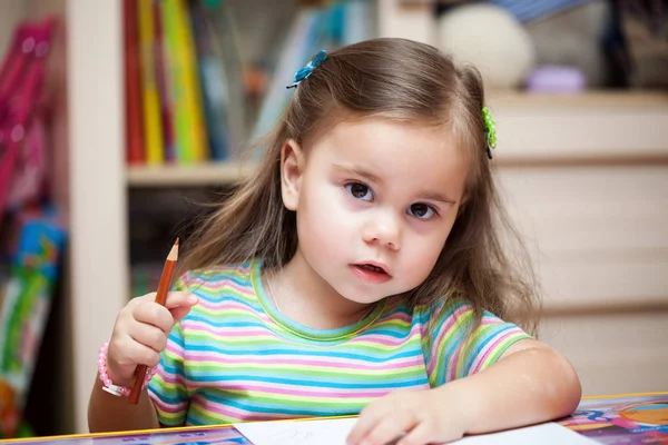 Happy little girl drawing with pencils — Stock Photo, Image