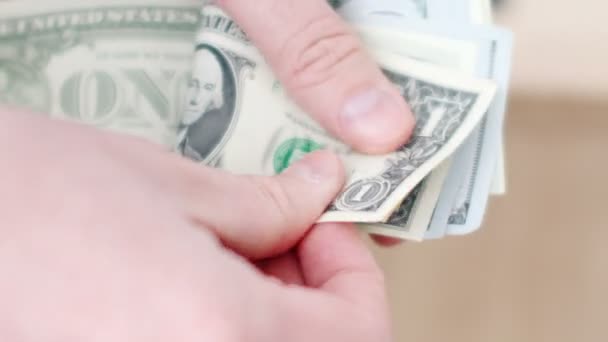 Close-up of a businessmans hands counting hundred dollar bills — Stock Video