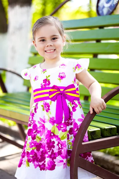 Portrait of adorable smiling little girl child in dress outdoor — Stock Photo, Image