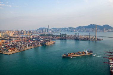 Hong Kong - 2020: ship with containers and Stonecutters Bridge from above