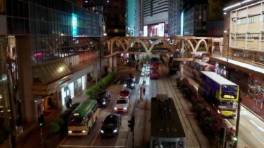 Hong Kong, China - 2020: night traffic on Yee Wo Street, cars, buses and trams