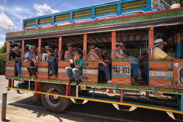 People riding a chiva bus in Medellin Colombia — Stock Photo, Image