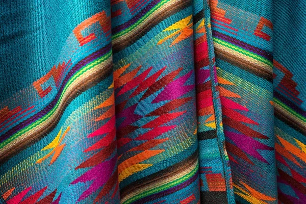 colorful textile closeup in Otavalo artisan market Ecuador