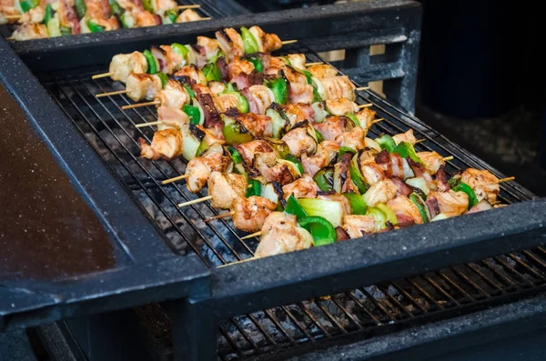 Traditional national czech street food , at the winter fair, barbecue grilled chicken with vegetables