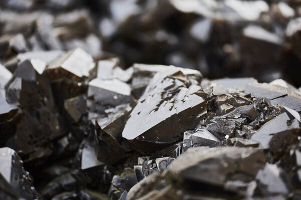 Closeup of dark grey black stone texture background