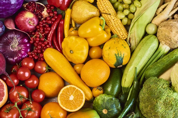 Colorful fruits and vegetables background. Rainbow collection