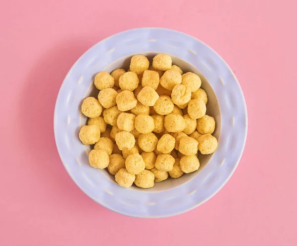 Piatto Blu Cereali Sfondo Rosa Vista Dall Alto — Foto Stock
