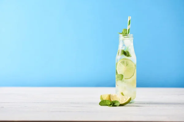 Mojito Cocktail Limes Mint Glass Bottle White Wooden Table Blue — Stock Photo, Image