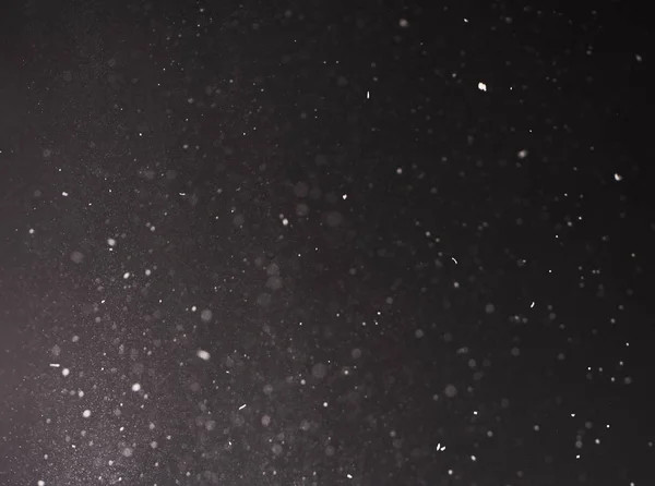 黑色背景下雪的弥散纹理特写 — 图库照片