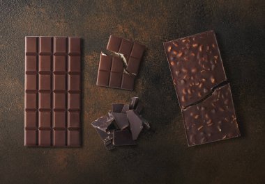 Different types of chocolate over dark background. High resolution image