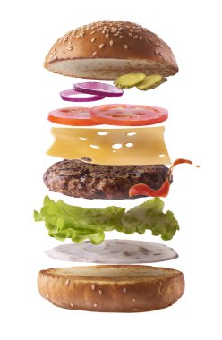Delicious burger with flying ingredients isolate