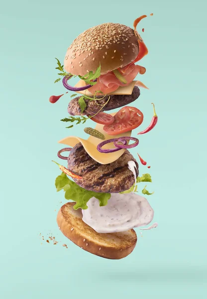Delicious burger with flying ingredients isolated